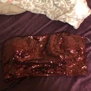 A maroon sequin top